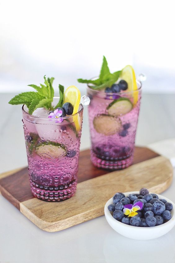 Another Mojito recipe with a twist, this time using the summer fruits Blueberry, Lemon and Cucumber along with Gin. This all natural ingredients summer cocktail will satisfy your cooling cravings this summer! #summercocktail #Mojito #Gin