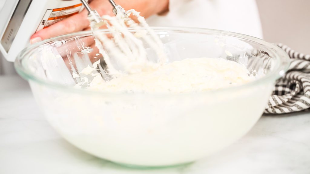Mixing vanilla buttercream frosting