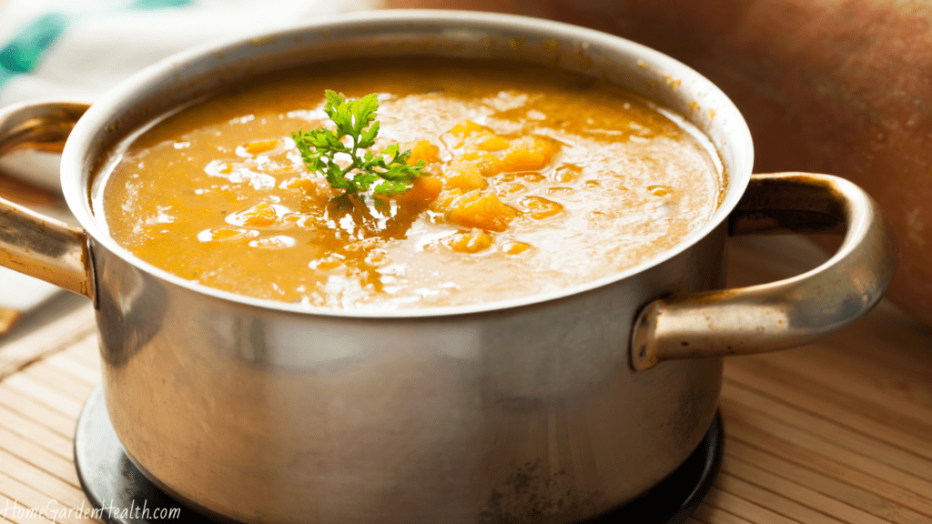 cooking put with butternut squash soup on the simmer