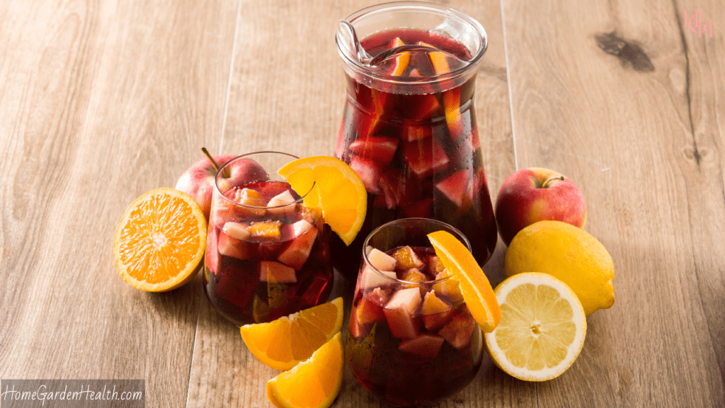 sangri filled jug and glasses with lemons and oranges