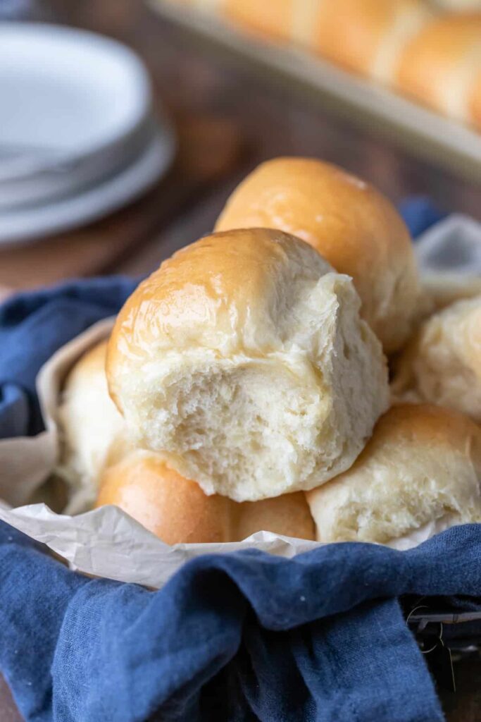 batch of homemade dinner rolls in a basket