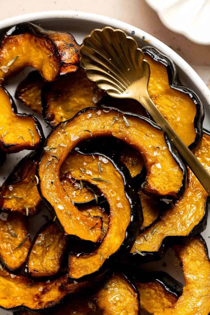 Maple Roasted Acorn Squash, vibrant yellow and browns with sea salt 